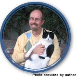 Frans Vischer author photo holding Felix a black and white cat