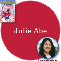 Julie Abe Signed Books Button - "Julie Abe" in ruby red circle with Tessa Miata Is No Hero cover in top left corner and a photo of Julie in bottom right corner.